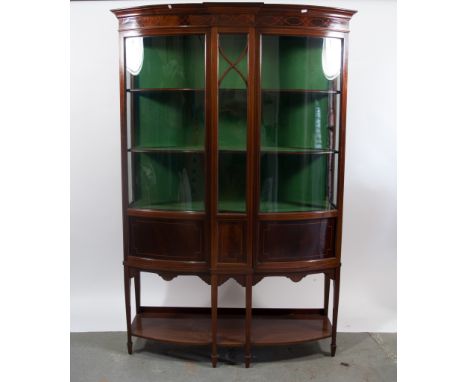 Edwardian mahogany bowfront china cabinet, with inlaid decoration, two glazed doors flanking a glazed central column, housing