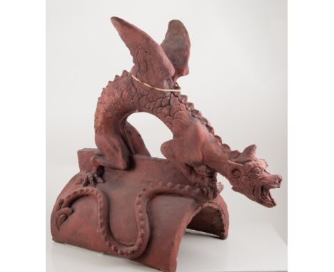 Terracotta ridge tile, formed as a winged dragon, 46cm high, 48cm total length.