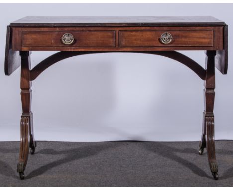 A George III style mahogany sofa table, rectangular top with drop leaves, rounded corners, fitted with two frieze drawers, ma