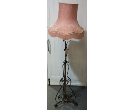 Late Victorian brass and wrought iron standard lamp, adapted to electricity, with shade, 192cm, as fitted.