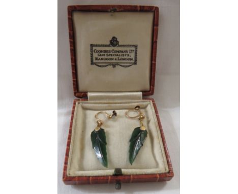 Pair of 9ct gold mounted pendant earrings carved as leaves in a green stone resembling spinach jade (length 2.5cm), with a Co