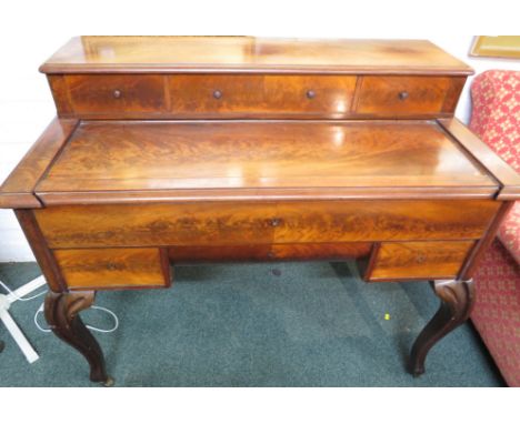 Victorian mahogany writing desk with a sliding cover revealing an extendable writing compartment with gilt tooled black leath