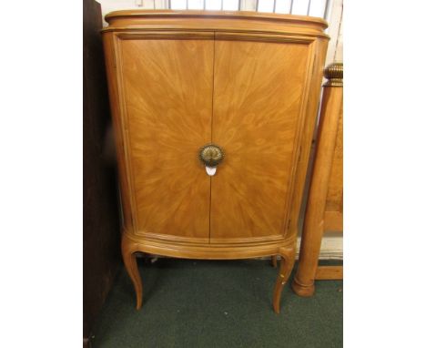 Striking late 20th century Biedermeier style cabinet on stand, in light figured wood veneer with embossed brass fittings manu