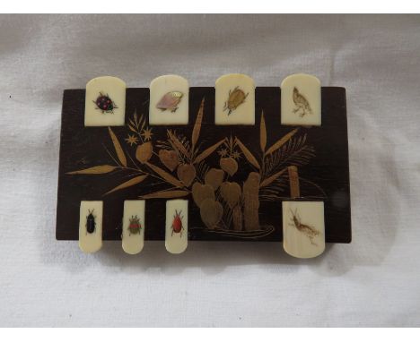 Three markers perhaps intended for mahjong or whist, each in dark hardwood gilded with flowers, with eight hinged bone flags 