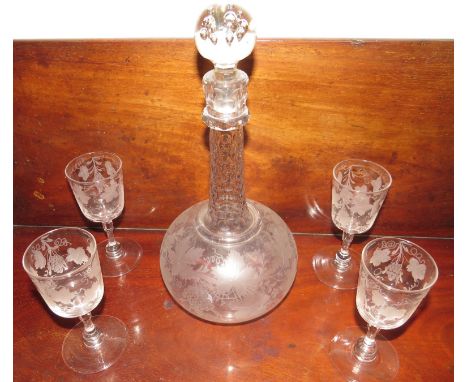 Four 19th century wine glasses, the bowls etched with vines, the stem with bulb above the foot and octagonal knop, height 13c