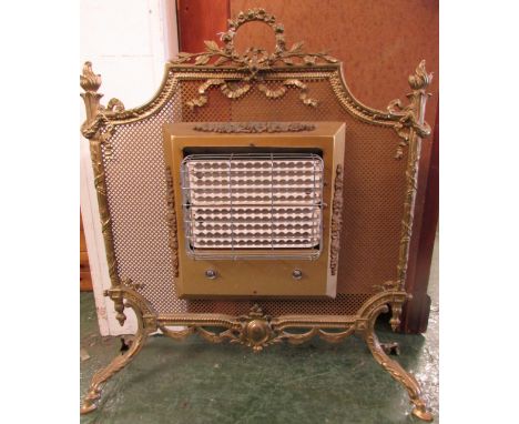 A vintage electric fire in a brass mesh frame standing on four hoof feet with acanthus mouldings, height 74cm width 70cm (sol