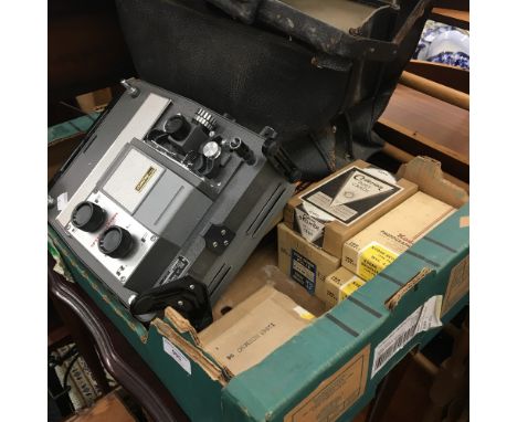 A Consul vintage film projector, together with a quantity of photographic paper, vintage cameras, etc.