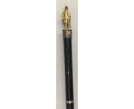 A swagger stick, the top mounted with a figure of an admiral 