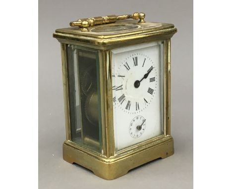 A late 19th/early 20th century brass cased carriage alarm clock