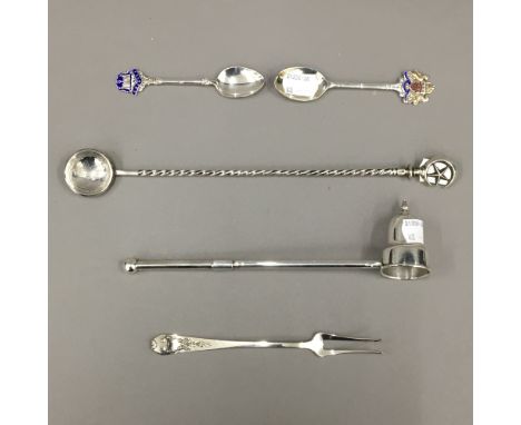A sterling silver candle snuffer, a sterling pickle fork, two silver and enamel souvenir teaspoons and an ottoman 800 silver 