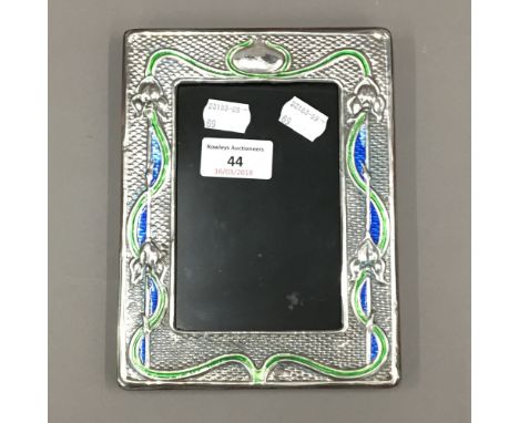 A silver Art Nouveau style frame