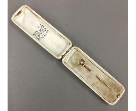 A seed pearl mounted stick pin, cased