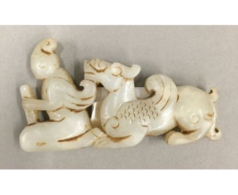 A jade figure of a man and a dragon