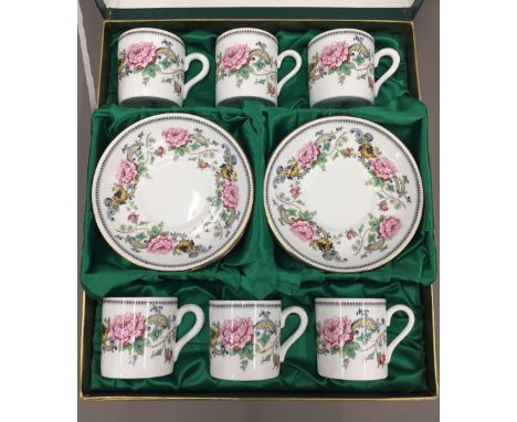 A boxed Crown Staffordshire coffee set and a Royal Adderley tea service and another