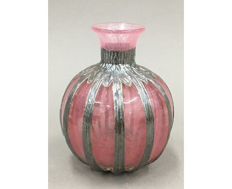 A silver clad Art glass vase