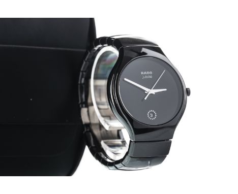 LADY'S RADO JUBILE CERAMIC QUARTZ WRIST WATCH, the round black dial lacking hour markers, date aperture at 6, 39mm case, with