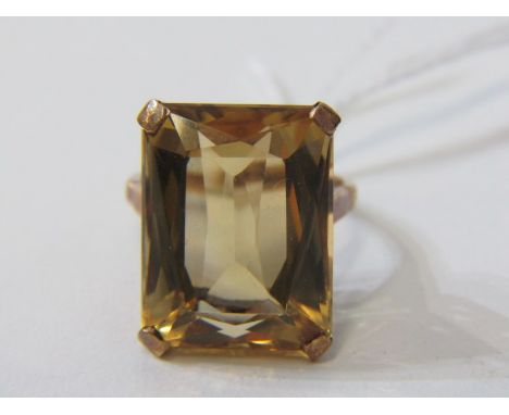 CITRINE RING, 9ct yellow gold ring set with a large emerald cut citrine, the stone approximately 18mm length, size J-K.&nbsp;