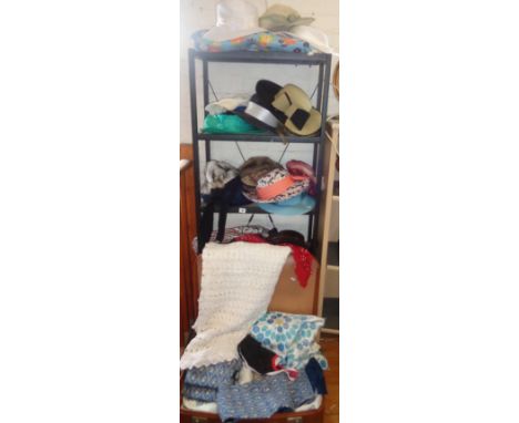 Quantity of assorted vintage ladies hats and a suitcase of vintage fabrics, including a heavy crocheted tablecloth and retro 