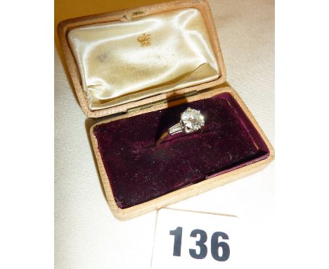 Gold ring with solitaire diamond (1.4 carat in size) in a prong setting with baguette shoulders, approx. UK size M-N