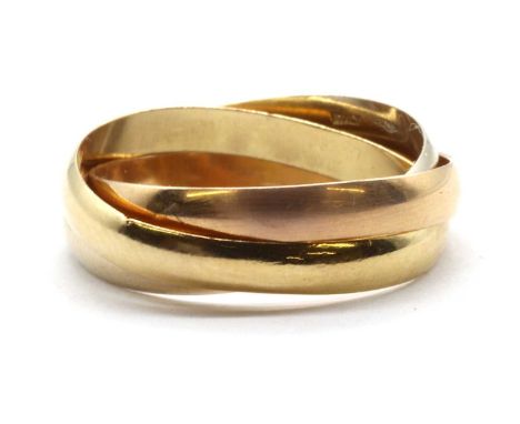 A three colour gold Russian wedding ring, with three interlocking light 'D' section bands, each approximately 3mm wide, in ro