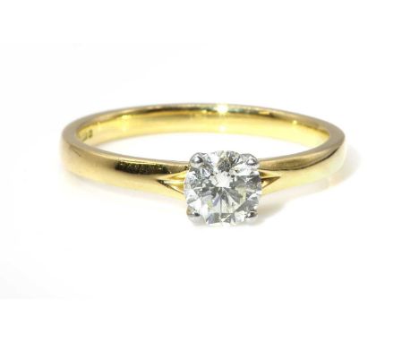 An 18ct gold single stone diamond ring,with a brilliant cut diamond, with a known weight of 0.57ct, four claw set to a white 