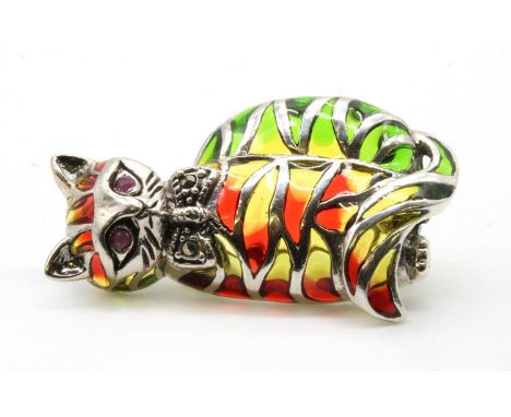 A silver plique-à-jour enamel and ruby cat brooch/pendant, with green, yellow and red plique-à-jour enamel to the body, to ru