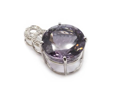 A 9ct white gold amethyst and diamond pendant,a round mixed cut amethyst, approximately 17mm, claw set, to crescent bale grai