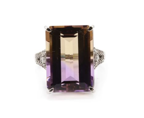 A 9ct white gold ametrine and diamond ring,an emerald cut ametrine, approximately 18 x 13mm, claw set, to split shoulders mic