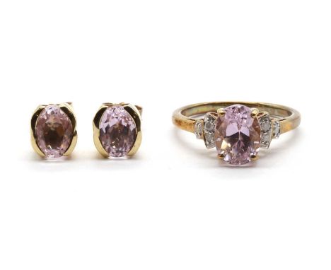 A 9ct gold kunzite and diamond ring,an oval mixed cut kunzite approximately 9 x 7mm, to stepped shoulders grain set with bril