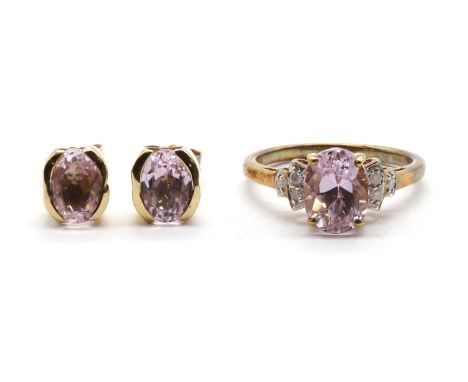 A 9ct gold kunzite and diamond ring,an oval mixed cut kunzite approximately 9 x 7mm, to stepped shoulders grain set with bril