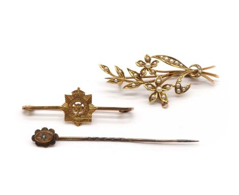 A gold split pearl spray brooch,with pin and 'C' catch, marked 15ct, tested as approximately 15ct gold with 9ct gold fittings