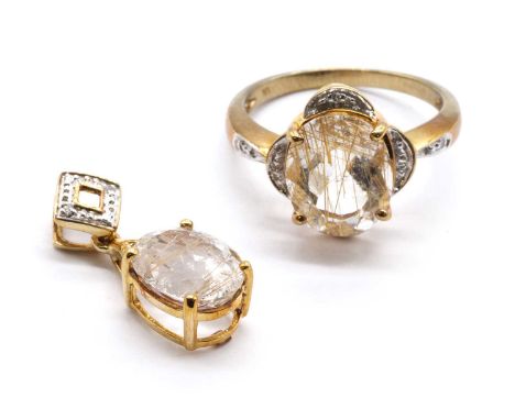 A 9ct gold rutilated quartz and diamond ring,an oval mixed cut rutilated quartz, approximately 11 x 9mm, to lobed surround gr