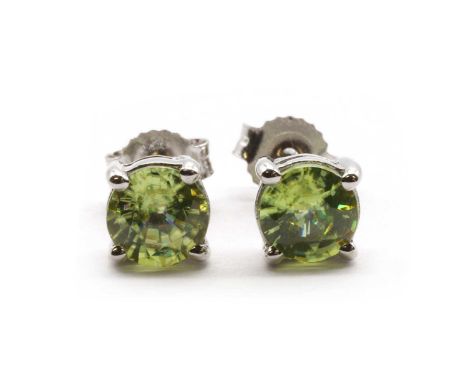 A pair of 18ct white gold single stone sphene stud earrings, a round mixed cut sphene, approximately 4.80-5.00mm, claw set to