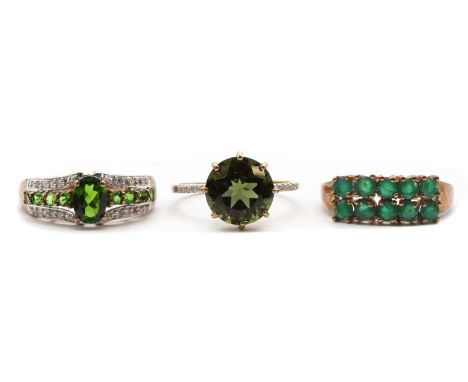 Three 9ct gold rings,comprising a chrome diopside and diamond ring, Birmingham 2010, a moldavite ring with diamond set should