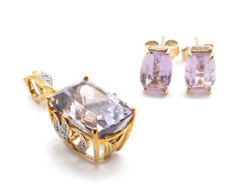 A 9ct gold amethyst and diamond pendant,a cushion cut amethyst, approximately 14 x 10mm, to eight cut diamond set gallery and