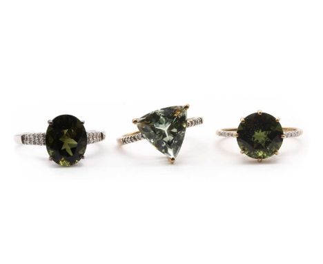Three 9ct gold rings,comprising a prasiolite quartz and diamond ring, a moldavite and diamond ring, and a white gold moldavit