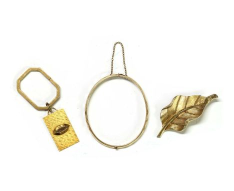 A large collection of costume jewellery,to include a gold plated Trifari brooch, a Dupont keyring, a bangle marked 9ct metal 