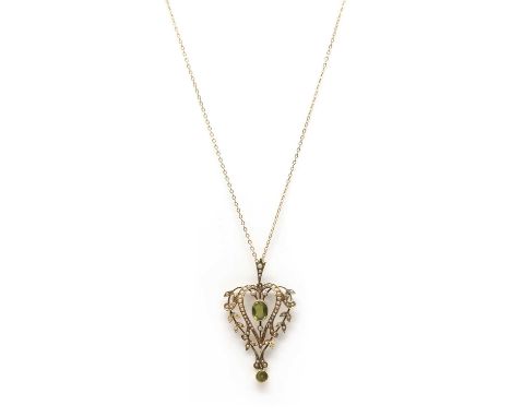 An Edwardian gold peridot and split pearl pendant, with articulated bale, tested as approximately 9ct gold, suspended on a la