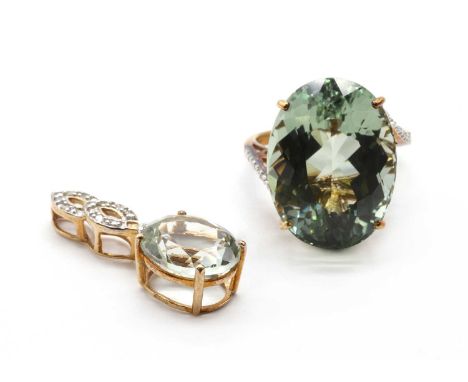 A 9ct gold prasiolite quartz and diamond ring,an oval mixed cut prasiolite quartz, approximately 20 x 15mm, claw set, to cros