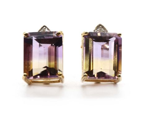 A pair of 9ct gold ametrine and diamond stud earrings,with an emerald cut ametrine, approximately 11 x 9mm, surmounted by a b