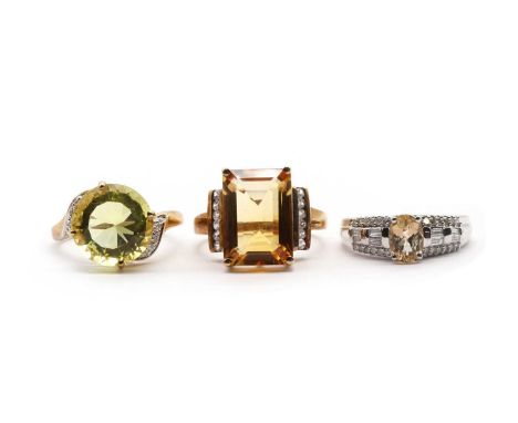 Three 9ct gold rings, comprising a lemon quartz and diamond ring, a citrine and white zircon ring, Birmingham 2011, and a whi