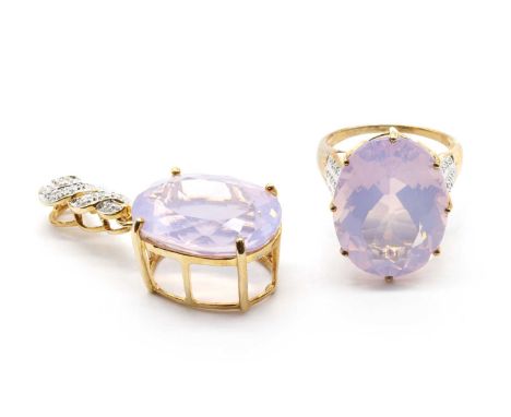A 9ct gold faceted rose quartz and diamond ring,an oval mixed cut rose quartz, approximately 20 x 15mm, to shoulders grain se