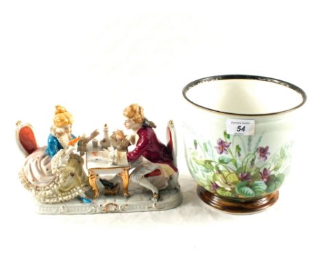 A continental porcelain card playing group and a floral porcelain jardinière