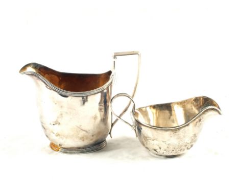 A Georgian Silver jug, London 1803 (as found) with a Silver cream Jug, Sheffield 1922