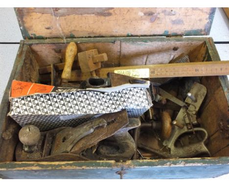 A Pine box containing planes and other tools