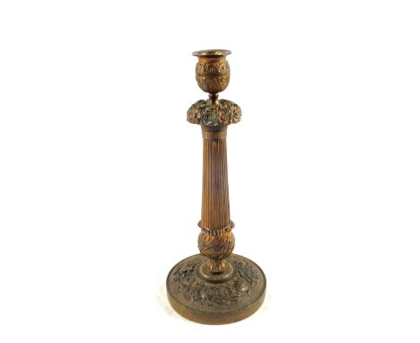 A large highly decorative early 19th Century French gilt Brass candlestick, 11 1/2" high