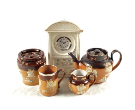 A selection of Royal Doulton, Doulton Lambeth ware including a Silver rimmed tankard and a Belleek mantel clock