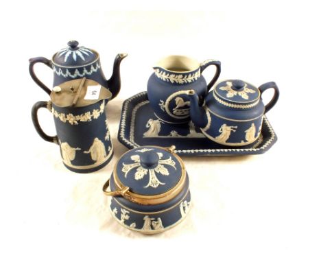 Two Adams blue Jasperware teapots, two jugs, preserve pots and a trinket tray