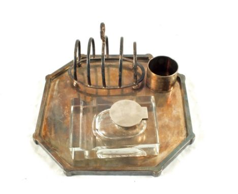 A mixed lot including a Silver toast rack, Birmingham 1924, a napkin ring, Sheffield 1893, an inkwell and a Silver tray