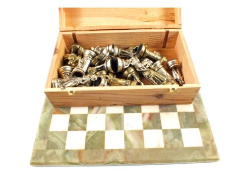 An Onyx chess board with cast metal figures